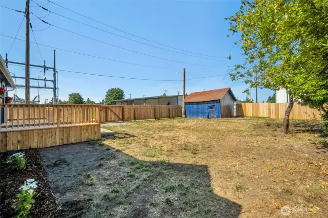 More flower beds in the back and a big back yard waiting for you to make it your own! Plus an outbuilding for some additional storage!