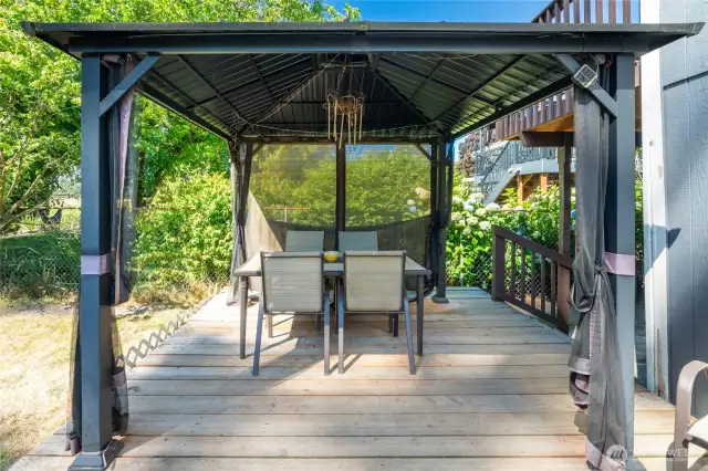 Pergola covered deck provides protection from PNW showers