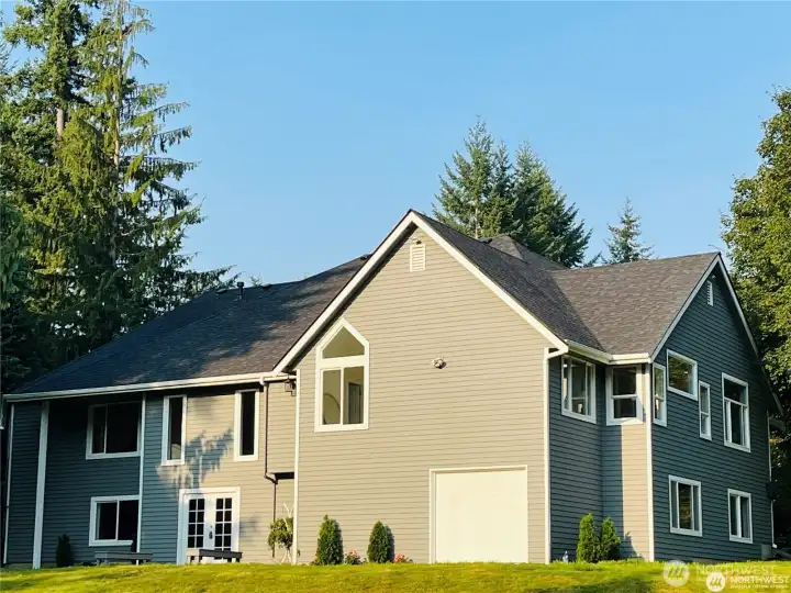 The new exterior paint and new roof enhances the home's fresh and updated appearance.