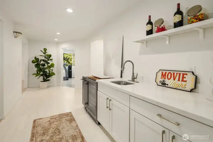 The basement includes a refreshment area that includes a sink, mini fridge and ice maker - great for hanging out and entertaining friends and family.