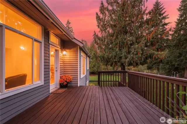 This photo highlights one of three custom-built decks, along with all new, light sensitive exterior LED fixtures - perfect for outdoor dining, relaxing, and taking in the picturesque park-like grounds.
