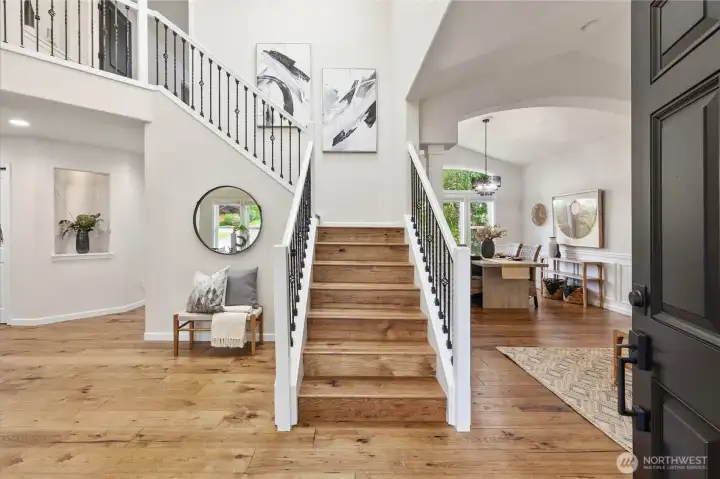 Spacious Entry with gleaming hardwood floors throughout most of the main floor.