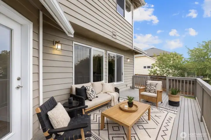 Spacious back deck. Virtually Staged