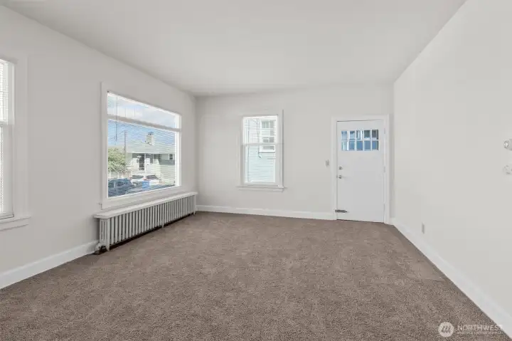 Upper-level living room with fresh paint and carpet!