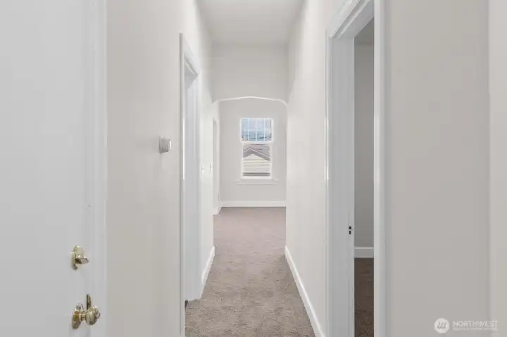 Upper-level looking down the hallway toward living room.