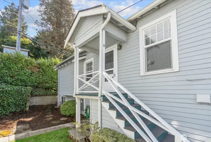 Freshly painted stairs, new sod and beauty bark have freshened up the exterior!