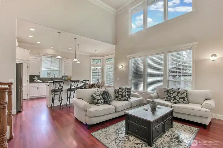 The open floor plan flows seamlessly into a stunning kitchen, where slab granite counters and newer stainless steel appliances shine against the crisp beauty of white cabinetry.The layout is ideal for hosting, allowing you to stay connected with guests whether you're preparing meals or enjoying a splash of music in the background.