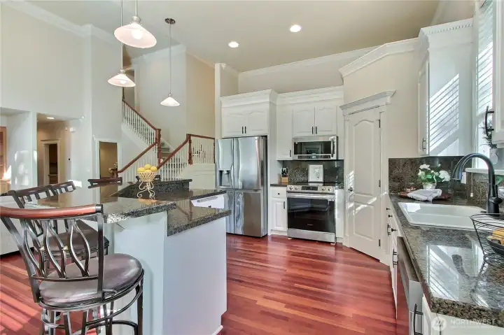 Natural light floods this area, highlighting the high-end finishes and warm, welcoming feel. Entertaining here is not just easy—it’s effortless and enjoyable. This space is as functional as it is stylish, offering plenty of prep room, storage, and modern conveniences to make cooking a joy.