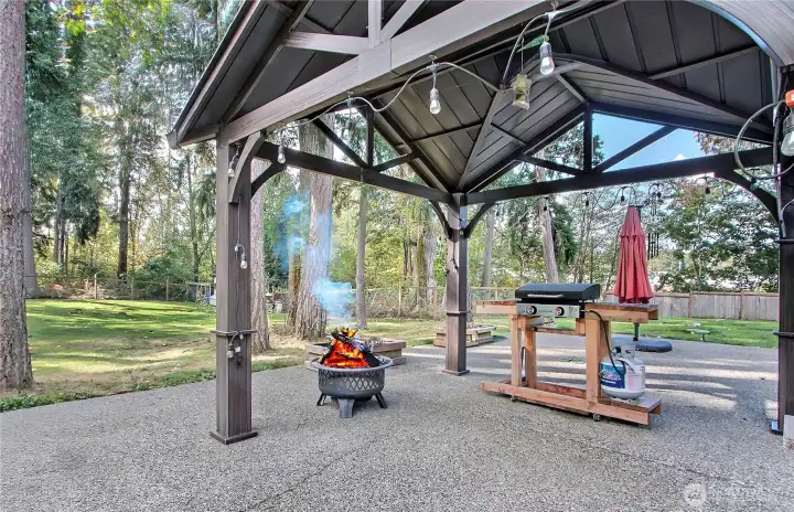 The large extended patio is a perfect outdoor living space, thoughtfully shaded by a newer gazebo that adds both style and comfort. Whether you’re hosting a summer BBQ or simply spending warm evenings with loved ones, this area creates a cozy and inviting atmosphere. The gazebo offers shelter from the sun while still letting you enjoy the fresh air, making it ideal for dining, relaxing, or entertaining. It’s the perfect spot to create lasting memories in your private backyard.