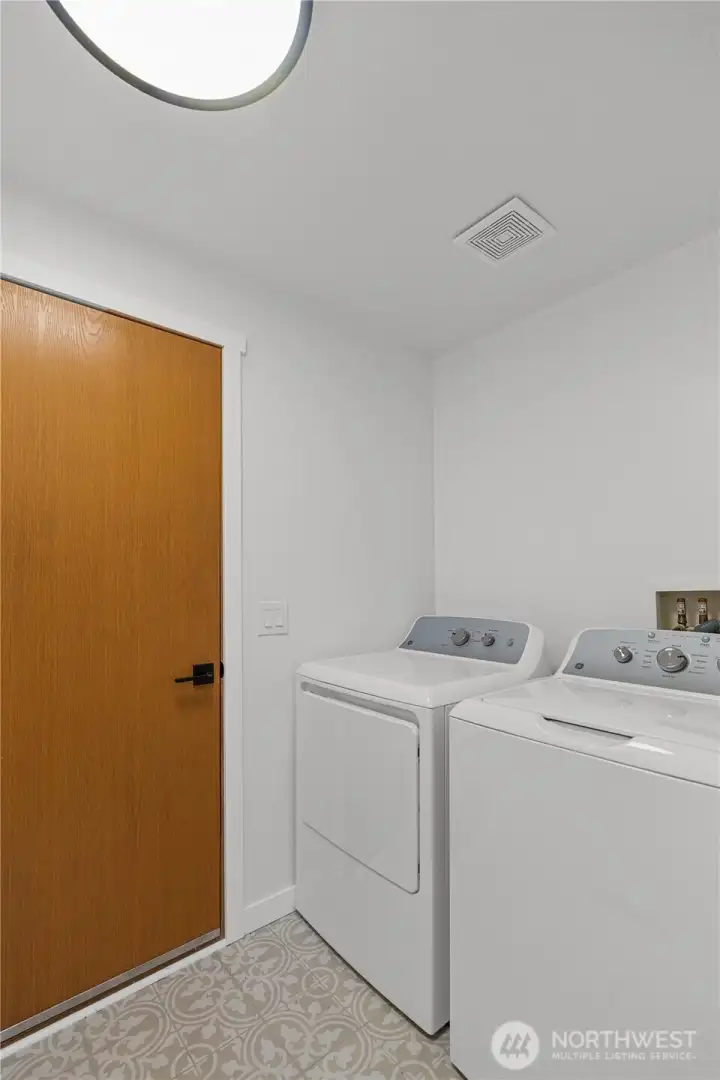 Laundry room with access to the garage.