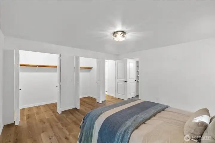 Primary bedroom with large double closets.