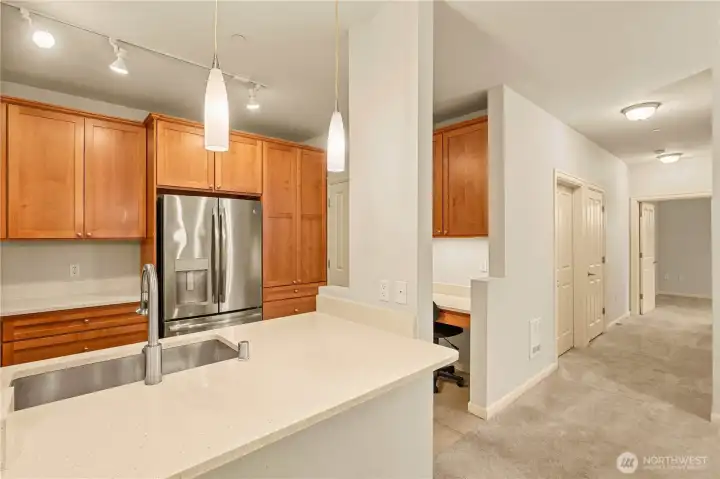 Kitchen has granite countertops, gas oven with cooktop and stainless-steel appliances
