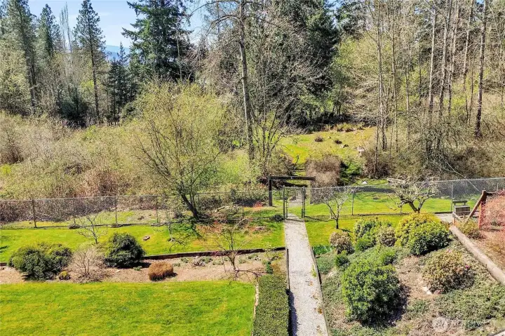 Landscaping with additional lot past fence.