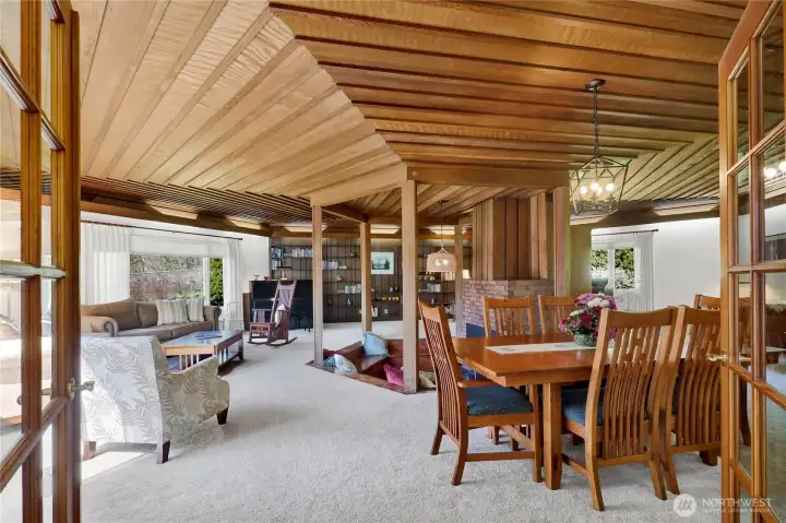Entering great room with beautiful cedar ceiling craftsmanship.  Large view windows let in abundant light.