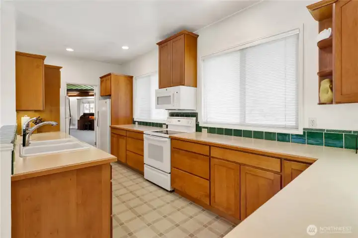 Large galley kitchen with stand alone freezer.