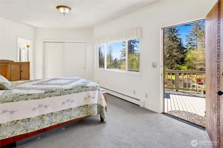 Primary with door to outside deck.