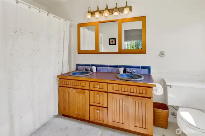 Primary bath with handmade ceramic sinks.