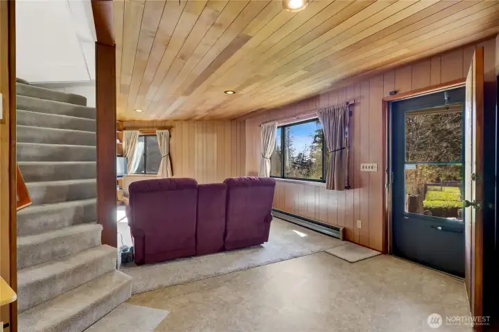 Lower level family room with door to outside.