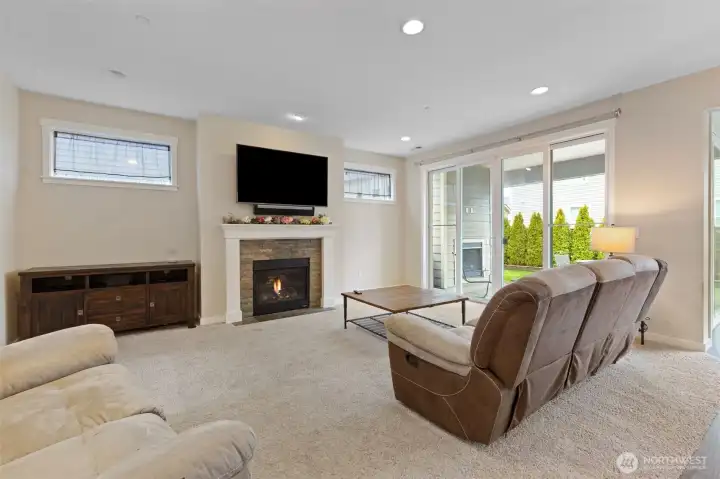 Large living room with Gas fireplace and large flat screen TV
