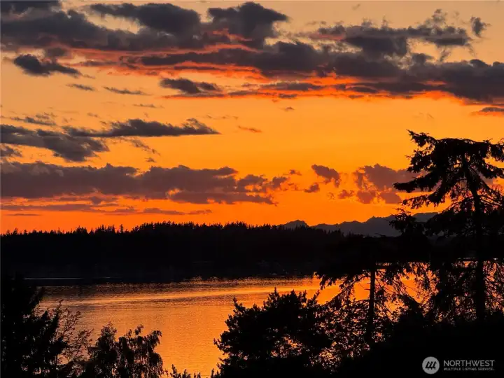 Sunset picture taken just a few days ago reflects some of the stunning landscapes viewed from this incredible home and property,