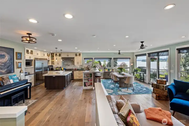 Beautiful plank flooring decorates this main living space just beautifully. Expansive marine views look towards Chambers Bay, Fox Island, Hale Pass, and the Olympics.