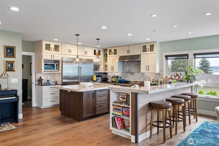 What a kitchen! The chef of the house will delight in all this space has to offer, from the SS appliances, incuding double ovens, two dishwashers, and an Electrolux refrigerator/freezer and Bertazzoni gas range with a pot filler, granite and quartz countertops, plenty of cabinet storage, and so much more.