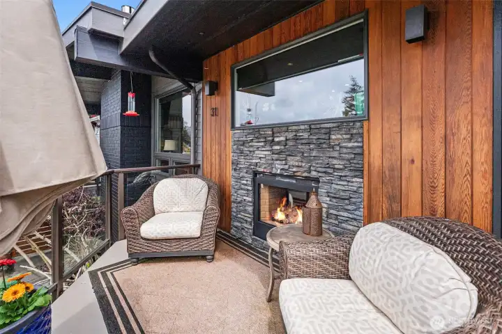 The gas fireplace is double-sided and allows for cozy nights whether inside or out on the beautiful deck.