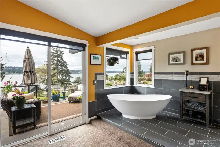 A vessel tub is perched on tile flooring and is a perfect place to relax and enjoy the gorgeous views and incredible sunsets after a long day.
