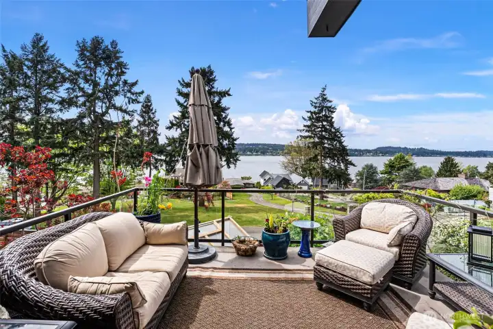 The private deck off of the primary suite enjoys marine and mountain views.