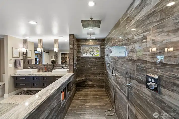 So much room here to enjoy in your private primary suite.  Double sinks, tons of lighting, and so much more, including.....