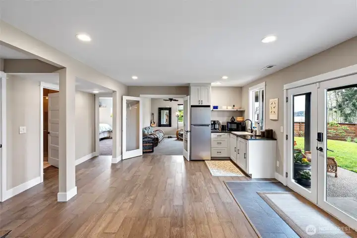 The lower level includes two bedrooms, an office space, and an additional room with a closet.  There is also a beautiful 3/4 bath on this level.