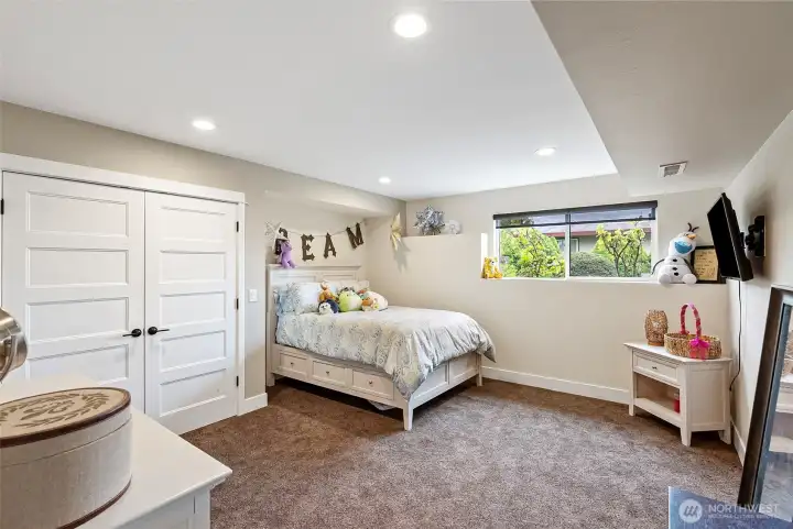 The bedrooms in this home are all large and have nice closet space. Can lighting helps keep things light and bright in the lower level of this gem.