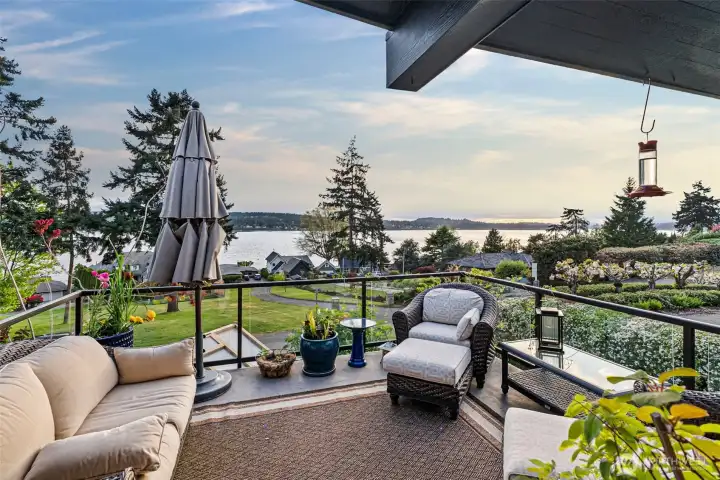 Enjoy incredibe sunsets off of your primary suite deck with glass railing for seamless views.