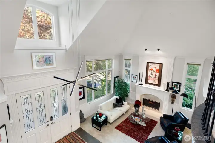 Dramatic entry with soaring ceilings and expansive windows for abundant natural light.