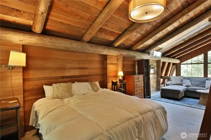 The second sleeping quarters and sitting area overlooks the living area.  Across from the bed are two big closets for storage.