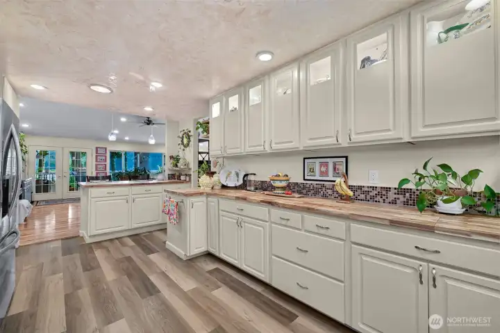 Backlit cabinetry glows overhead.