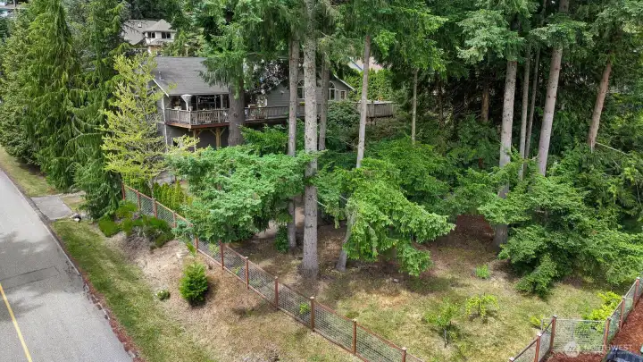 Benefit from an enormous fenced property spanning across 3 lots.