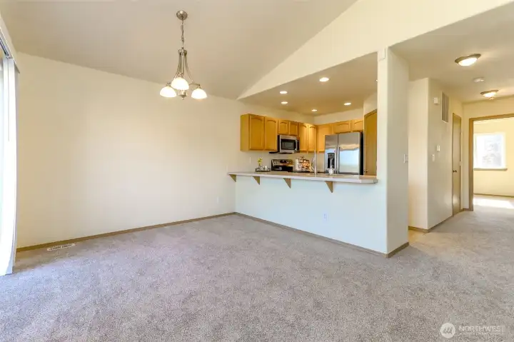 This angle is from the dining room with the hallway leading to the half bath and primary bedroom. This angle is from the dining room with the hallway leading to the half bath and primary bedroom.