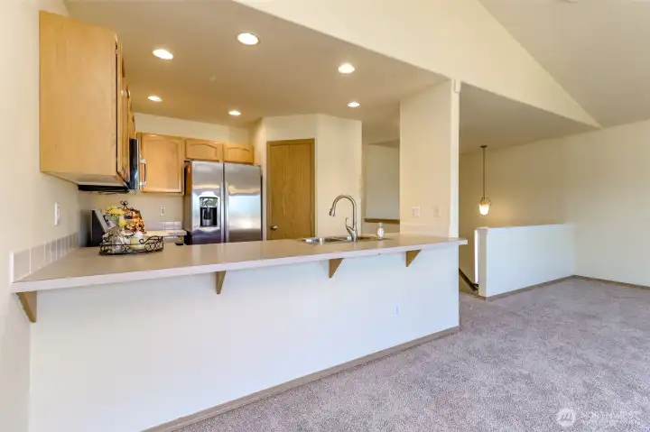 Breakfast bar with plenty of room for barstools. Breakfast bar with plenty of room for barstools.