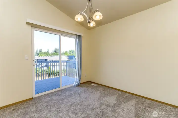 Another view of dining room leading to deck. Another view of dining room leading to deck.