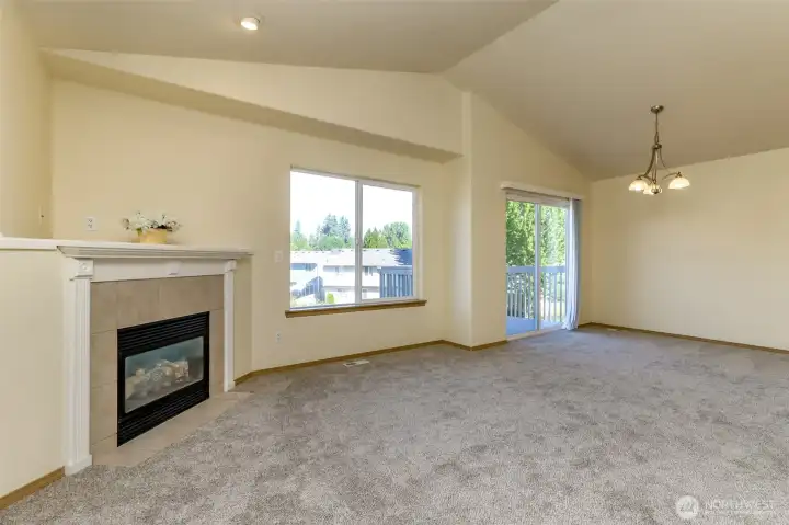 Large spacious fireplace mantel, vaulted ceilings and deck access off main living area. Large spacious fireplace mantel, vaulted ceilings and deck access off main living area.
