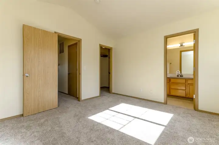 Primary bedroom, bathroom ad walk in closet. Vaulted ceiling and two windows with lots of natural light. Primary bedroom, bathroom ad walk in closet. Vaulted ceiling and two windows with lots of natural light.