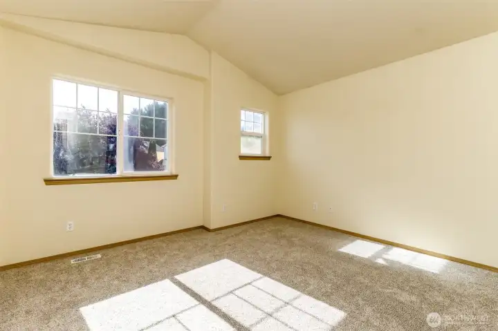 Primary bedroom with vaulted ceilings. Primary bedroom with vaulted ceilings.