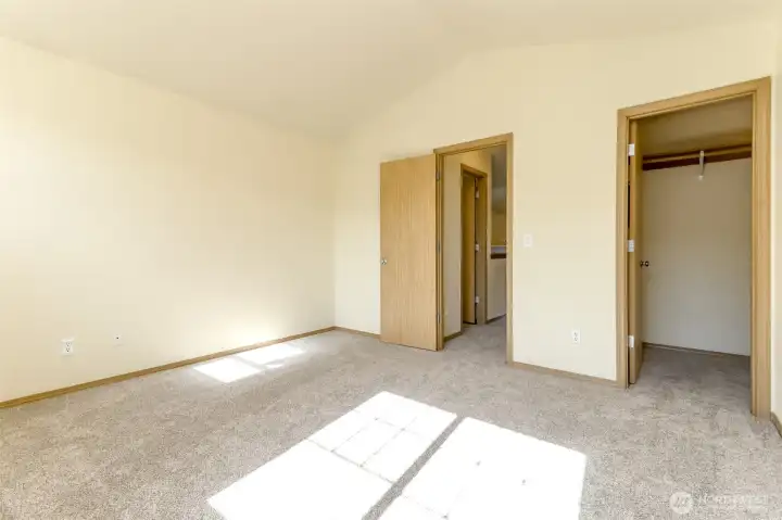 Walk in closet to the right and the door to the left leads to the hall and half bathroom. Walk in closet to the right and the door to the left leads to the hall and half bathroom.