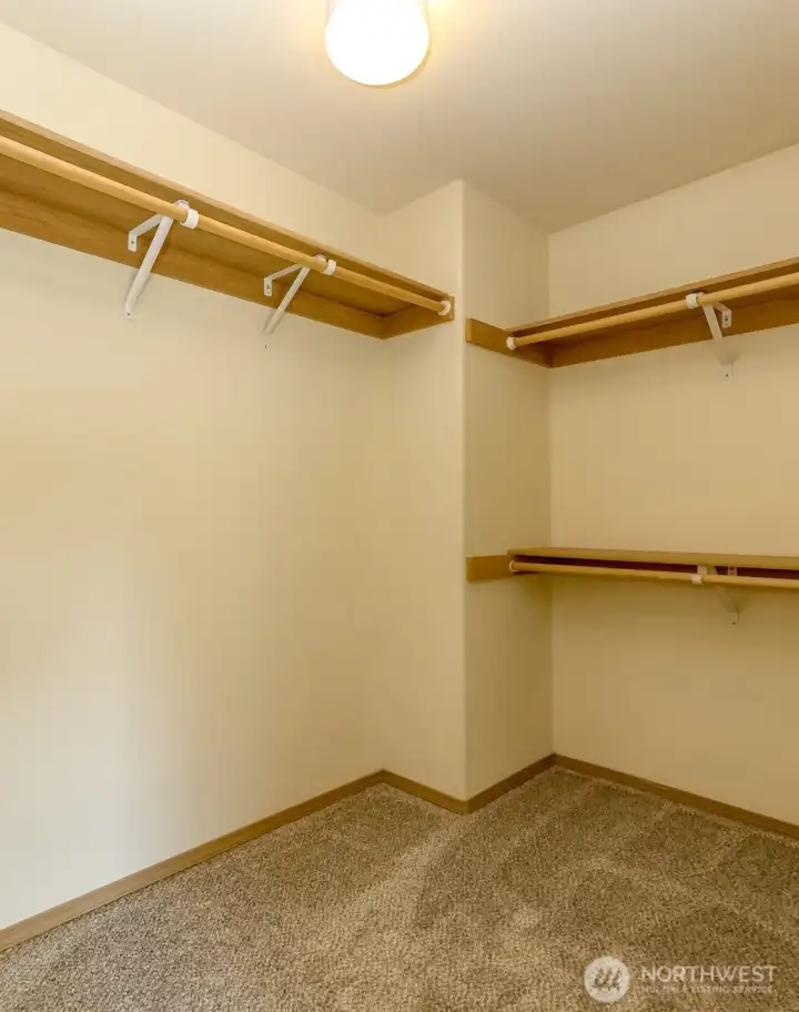 Primary walk in closet. Primary walk in closet.