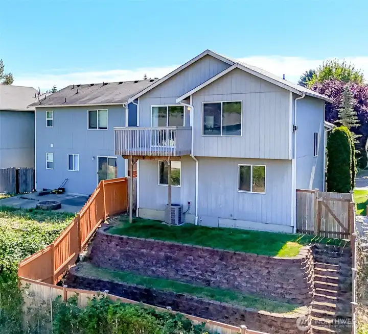 This tiered yard is a great spot for your own vegetable or flower garden area. Easy access yet a designated garden area separate from the yard. This tiered yard is a great spot for your own vegetable or flower garden area. Easy access yet a designated garden area separate from the yard.