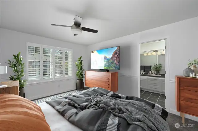 Spacious master bedroom with plantation shutters and private master bath.  Photo is virtual staging.