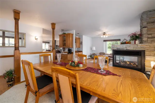 Formal dining room with fireplace and a wet bar in the entry to the kitchen.