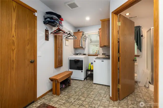 Large laundry room and 3/4 bath off the garage/shop.