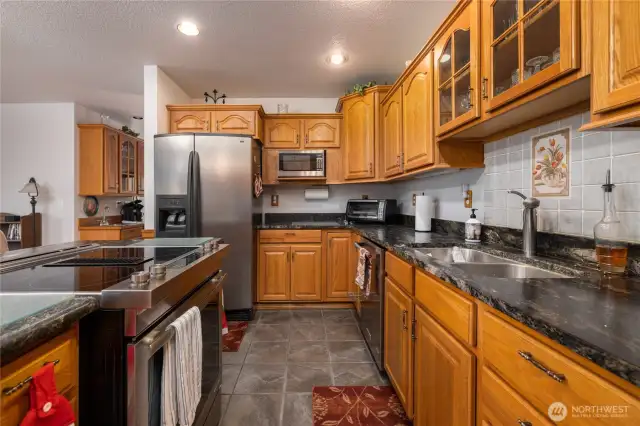 Slate flooring is easy to care for.  This is a dream kitchen.